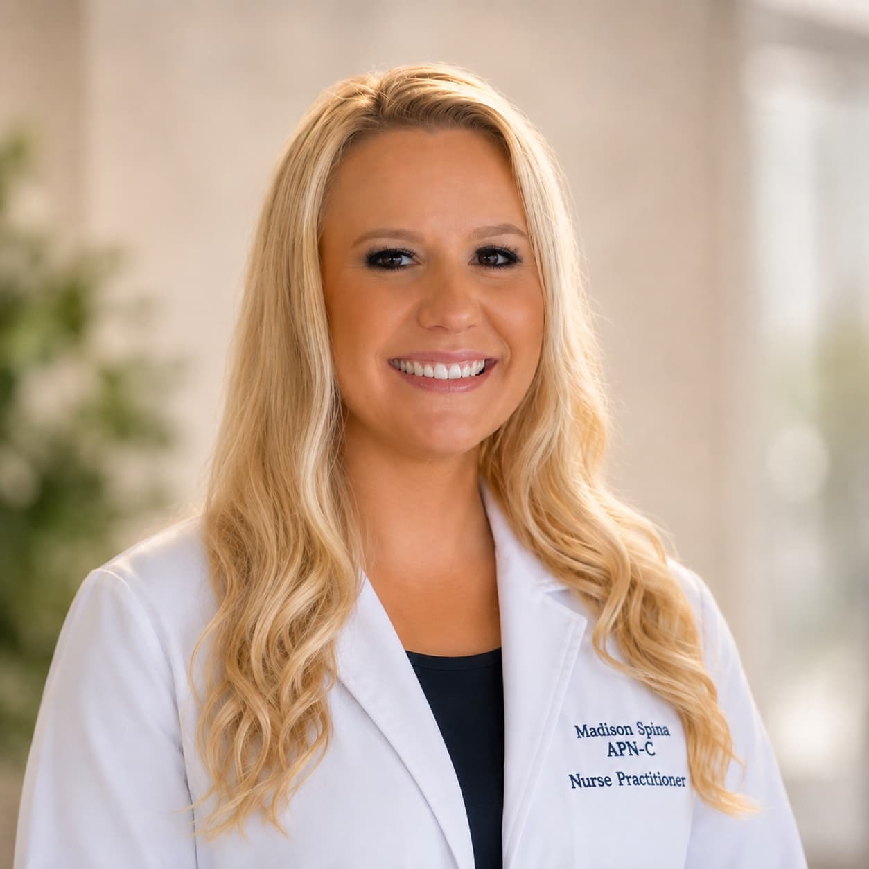 Madison Spina, Nurse Practitioner at 360 Health Center, smiling in a white coat.